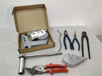 lot of hardware - pliers, socket wrench, etc.