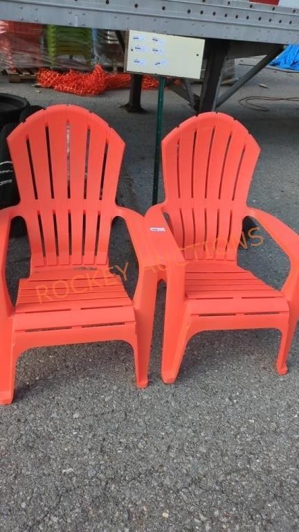 Pair of orange plastic Adirondack chairs
