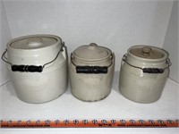 Set of three stone ware ceramic crocs with lids