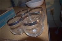 Four Drinking Glasses with Silver Trim