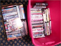 Two containers of DVD movies