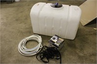 100 GALLON POLY TANK WITH PUMP AND HOSE, WORKS PER