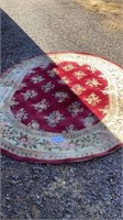 Oval rug measures approximately 90 x 116 inches