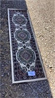 Rug measures 86 inches long and 25 inches wide