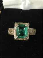 STERLING AND CZ RING WITH GREEN CENTER STONE;
