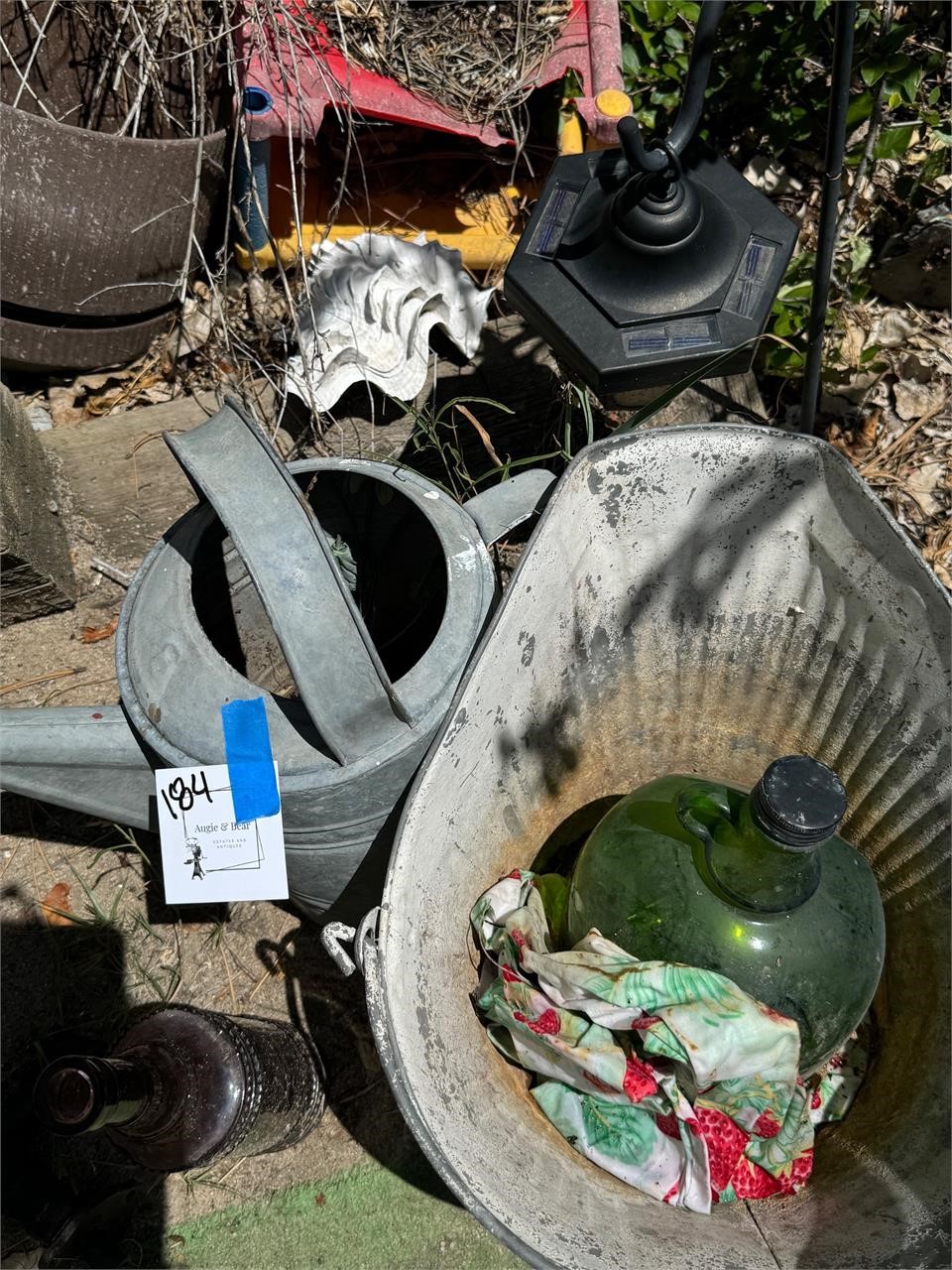 Old outdoor glass bottles and tin set