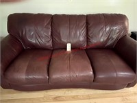 Leather Sofa (burgundy in color, facing window)