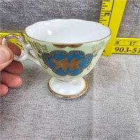 Teacup With Blue And Gold Flowers