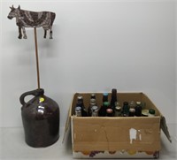box of bottles and stoneware jug