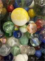 Boxed lot of vintage marbles. Various sizes and
