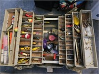 Tackle box full of fishing tackle.
