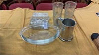 Two glass butter holders, two glass boot drinking