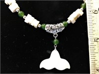 Jade and ivory bead necklace with an ivory whale's