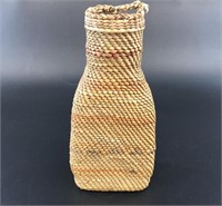 Antique glass bottle with cedar bark wrapping Paci