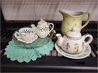 Teap lot, decorative teapots, doilie, pitcher,