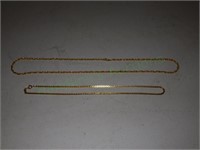 Two Gold Tone Chains