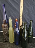 collection of 9 colored bottles