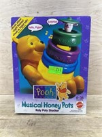 Unopened Winnie the Pooh musical honey pots