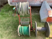 Hose reel on carrier with extra full and empty