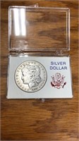1889 O Morgan silver dollar coin in case