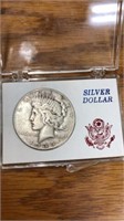 1935 Peace silver dollar coin in case