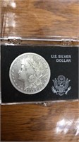 1882 Morgan silver dollar coin in case