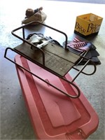 Old sled with metal frame and wooden floor with