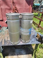 Two stainless steel beer kegs