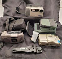 35mm cameras in cases (Olympus, Kodak, Pretec)