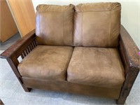 LEATHER LOVE SEAT WITH WOODEN ARMS