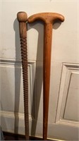 2 vintage walking cane sticks , one hand carved