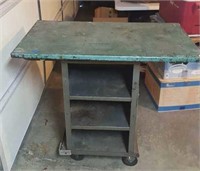 Heavy metal cart on casters with heavy metal top