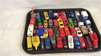 Collection of matchbox style toy cars and trucks