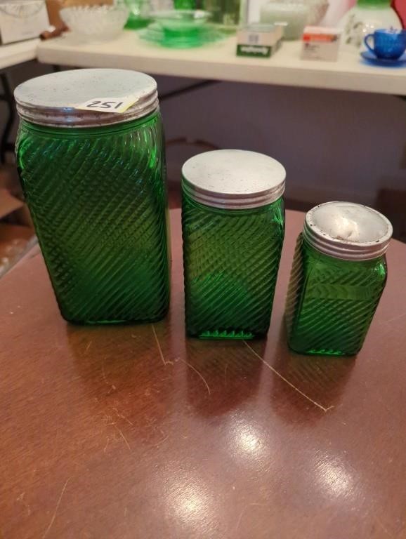 3 green canister jars with metal lids