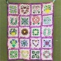 Quilted Wall Hanging with Hearts and Flowers.