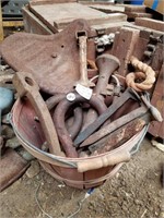 BUCKET OF MISC IRON TOOLS AND OLD BIKE SEAT
