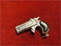 Vintage miniature derringer cap gun.