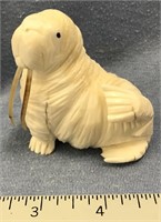 3" fossilized ivory carving of walrus with walrus