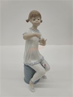 Lladro Girl painting nails figurine b-27m