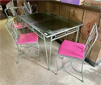 Wrought iron patio table and 4 chairs