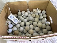 Box of golf balls including noodle, fitleist, and