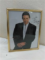 Autographed picture of Mickey gilley