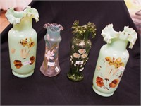 Four green Victorian decorated glass vases: