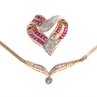 A Lady's Diamond Necklace and Heart Pendant in 14K