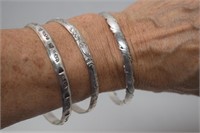 Three Silver Bangle Bracelets