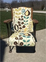Reupholstered antique theater chair.