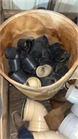 Bin with plastic pipes and fittings