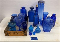 Blue glass bottles, decanters, glassware