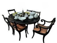 REGENCY STYLE EBONIZED DINING TABLE AND SIX CHAIRS