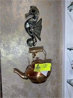 Copper looking tea kettle and seahorse